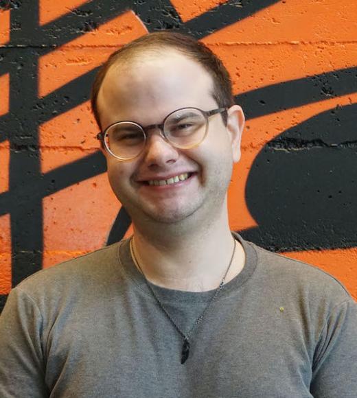A waist-up portrait photo of Brandon Knieriem