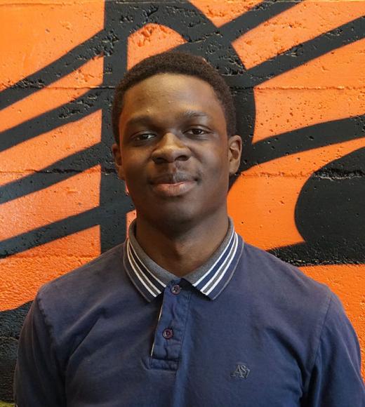 A waist-up portrait photo of Yaw Mireku