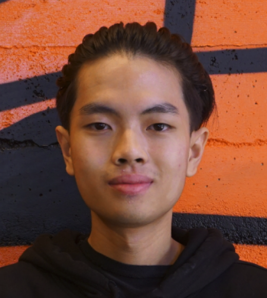 A waist-up portrait photo of Kyle Nguyen