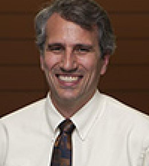 A portrait photo of Tim Leamy
